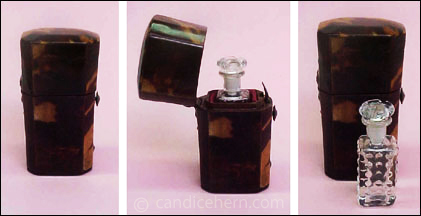 Figure 2: Tortoise shell case (2 1/4" tall) with sterling fittings; interior lined in red silk. Molded glass bottle (1 1/2" tall) with ground stopper. c. 1780